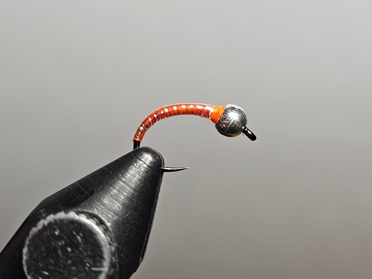 A disco midge or disco perdigon fly pattern tied by New England Fly Company