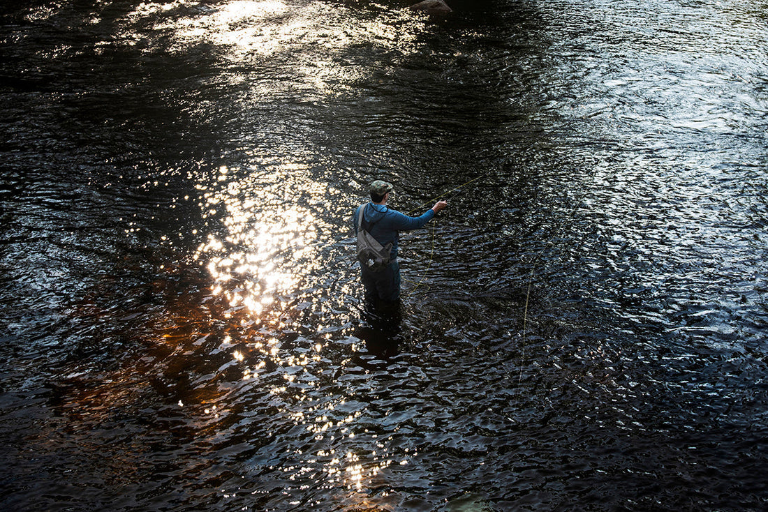 A lone fly angler casts in the Crooked River near Sebago Lake in Maine.