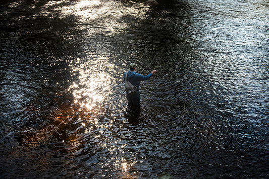 A lone fly angler casts in the Crooked River near Sebago Lake in Maine.