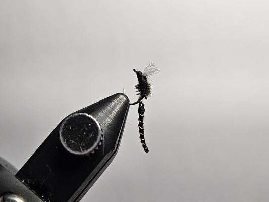 An articulated midge fly pattern tied by New England Fly Company.