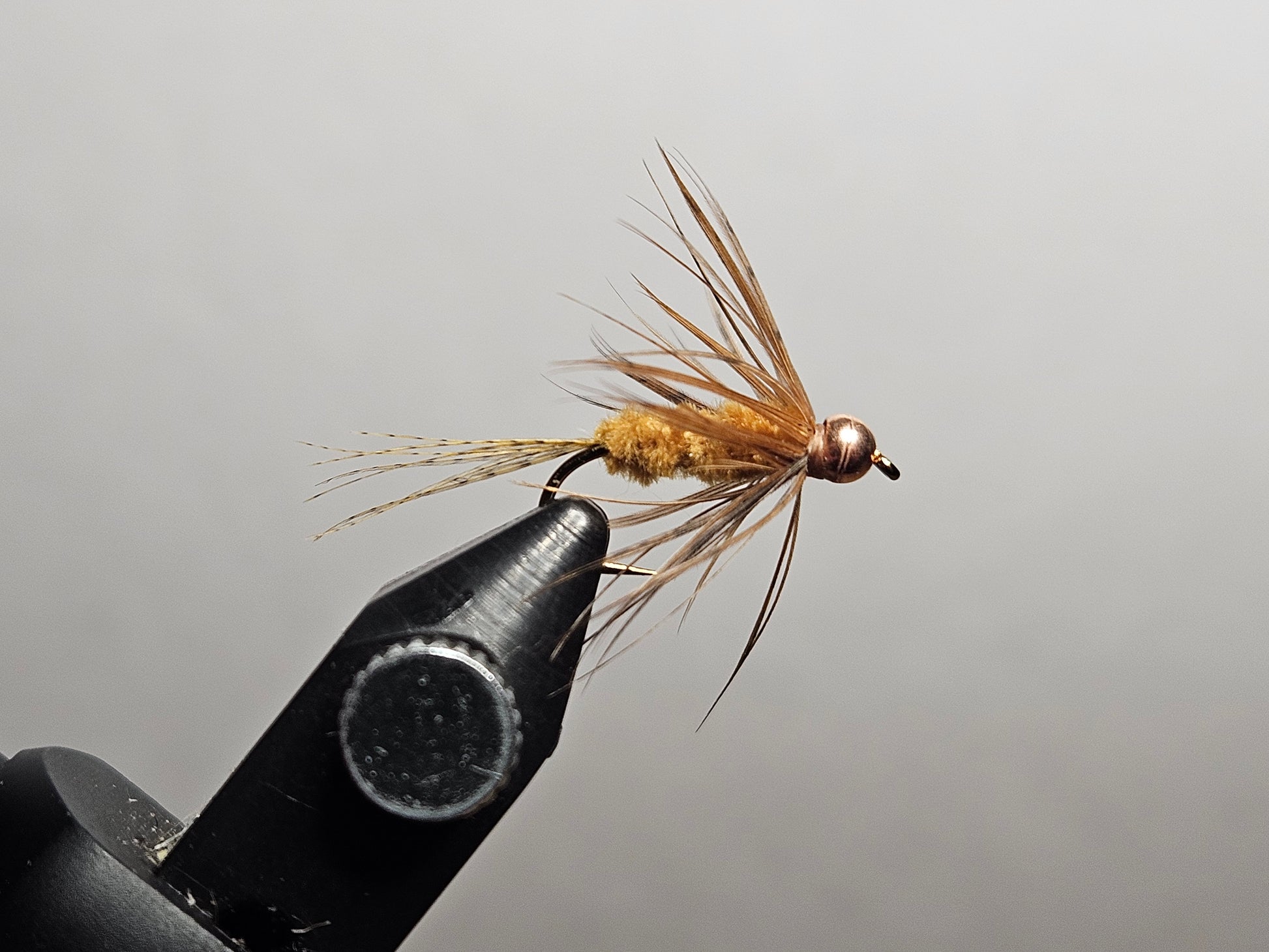Maple syrup fly pattern with hackle, a New England pond classic invented by Maine angler and tyer Alvin Theriault, tied by New England Fly Company