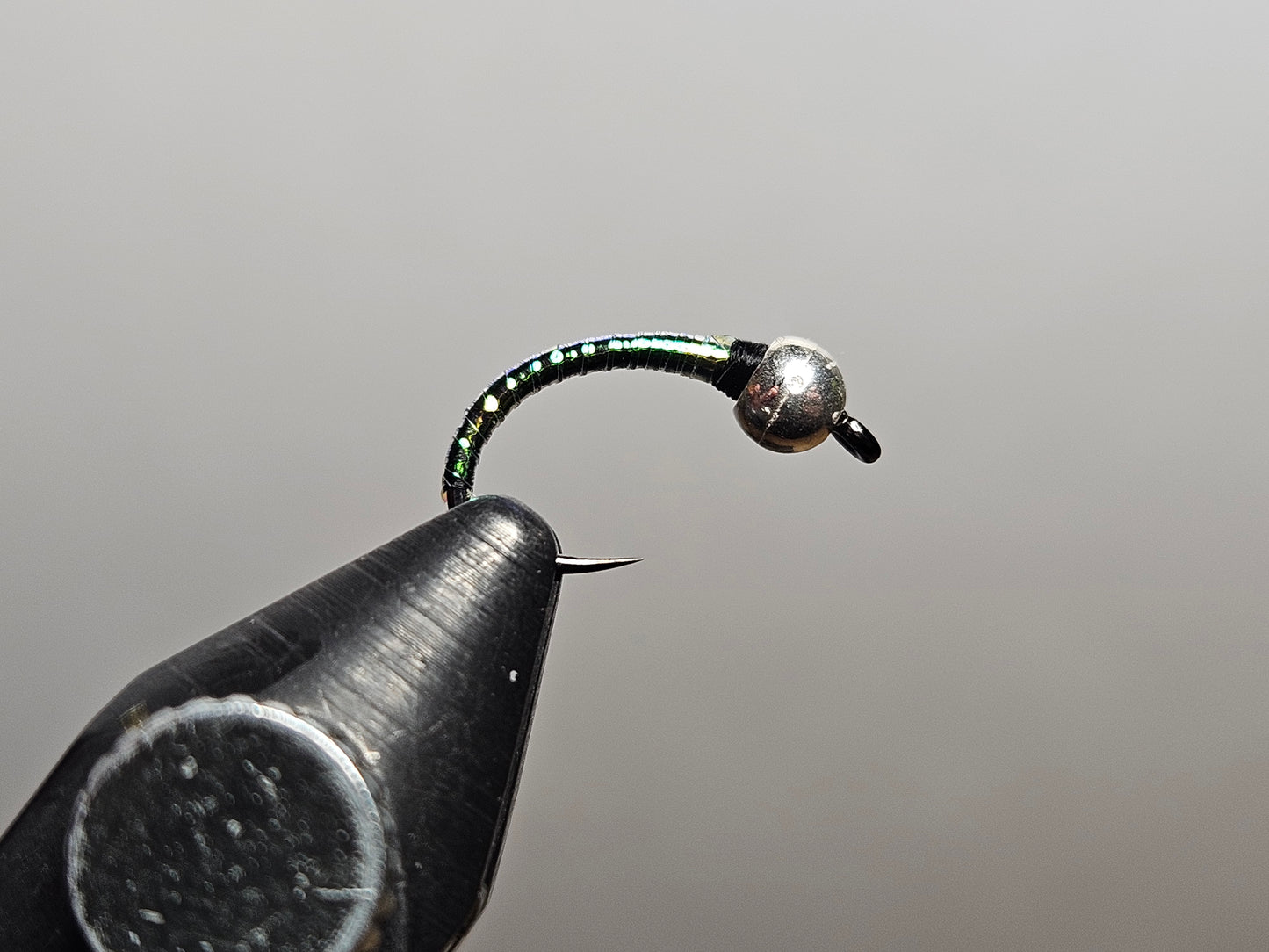 A disco midge or disco perdigon fly pattern tied by New England Fly Company