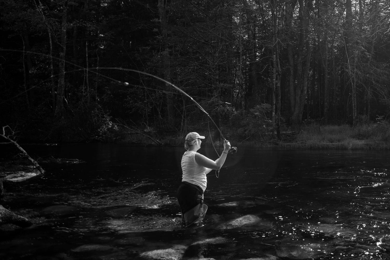 pregnant woman fly fishing the presumpscot river in Maine