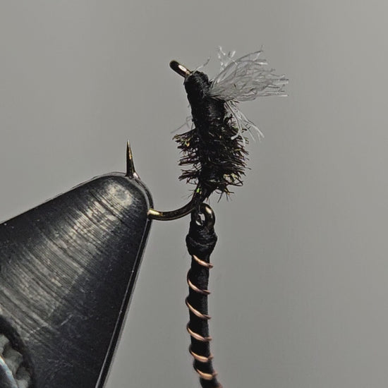 A video of an articulated midge fly pattern tied by New England Fly Company that shows the motion of the articulated back section.